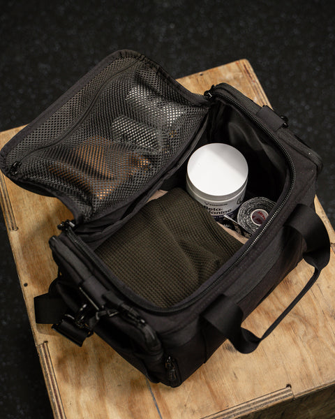 Packed internal, birds eye view of KNKG mini black CORE Duffel 