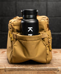 Water bottle inside pocket of KNKG desert tan color mini CORE duffel