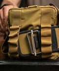 Matching lifting belt being attached to KNKG desert tan color mini CORE duffel