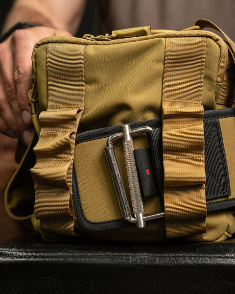 Matching lifting belt being attached to KNKG desert tan color mini CORE duffel