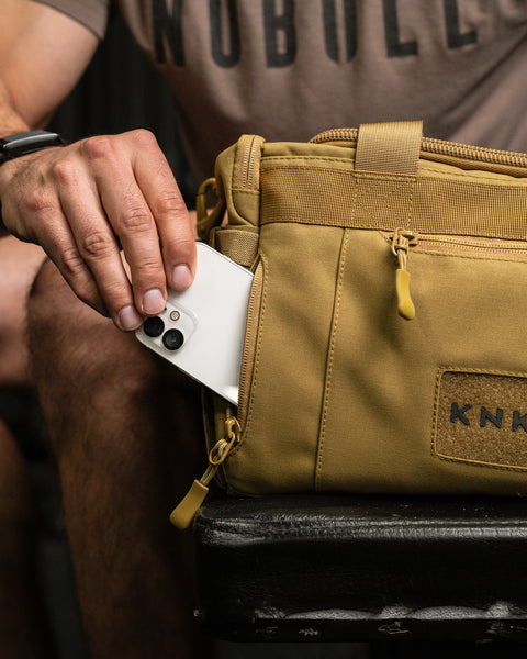 Phone pocket on KNKG desert tan color mini CORE duffel