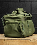 Side pocket of green KNKG mini duffel