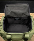 Empty inside view of green KNKG mini duffel 