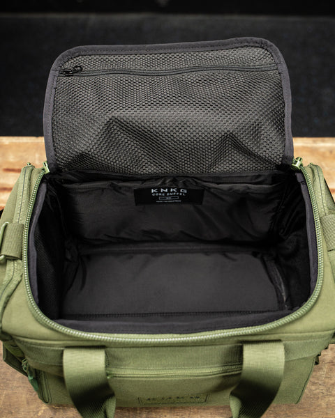 Empty inside view of green KNKG mini duffel 