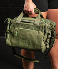 Personal holding green KNKG mini duffel