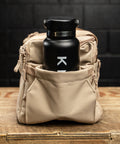 Black water bottle in side pocket of Neutral beige KNKG mini CORE Duffel