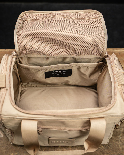 Inside view of empty Neutral beige KNKG mini CORE Duffel