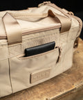 Front pocket of Neutral beige KNKG mini CORE Duffel with wallet inside