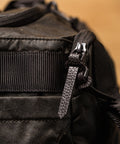 Close up of leather zips on KNKG Waxed Canvas Duffel 