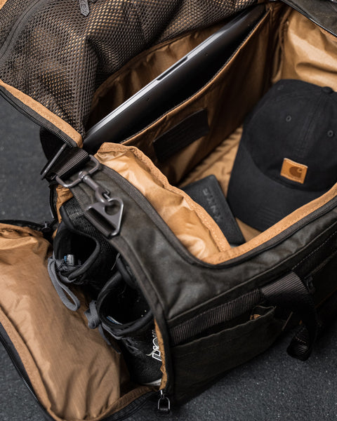 Inside view of shoes inside KNKG Waxed Canvas Duffel 