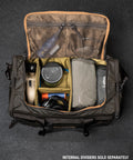 Open KNKG Waxed Canvas Duffel birds eye view of packed bag with gym essentials 