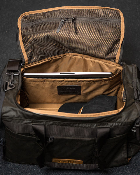 Laptop sleeve inside KNKG Waxed Canvas Duffel 