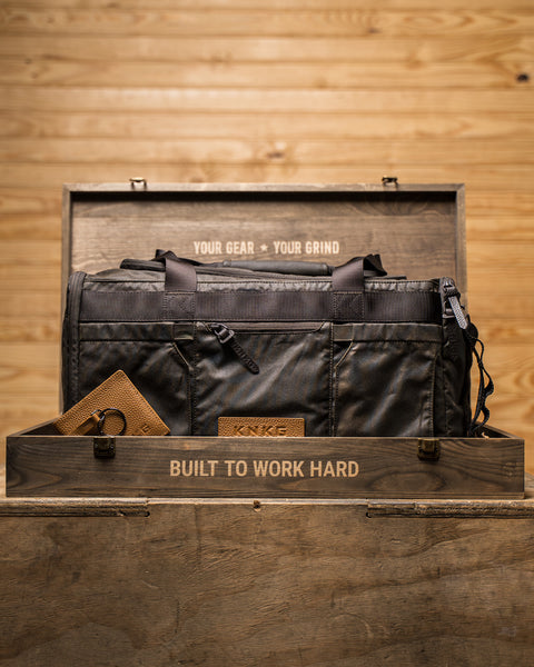 KNKG Waxed Canvas Duffel in wooden box