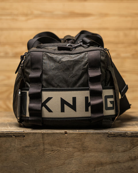 Close up of lifting belt sleeve on KNKG Waxed Canvas Duffel 