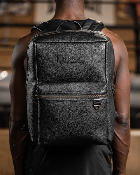 black leather backpack with metal Ikigai Dusk / Gun This leather roll top backpack uses a flexible upper section and crossed front straps to create a recognizable X Celine Structured Black Calf Leather